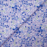 Popeline de coton imprimée nuage de myosotis fond lavande
