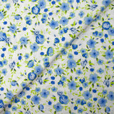 Popeline de coton imprimée fleurs du temps bleu et vert anis fond blanc