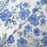 Popeline de coton imprimée porcelaine en fleurs bleues fond blanc