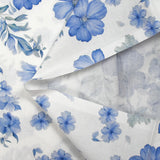 Popeline de coton imprimée porcelaine en fleurs bleues fond blanc