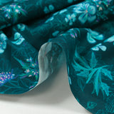 Popeline de coton imprimée fleurs turquoise fond bleu foncé