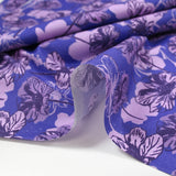 Cotton poplin printed silhouette in lilac flowers indigo background