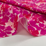 Popeline de coton imprimée fleurs en fusion fuchsia et magenta fond écru