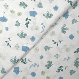 Popeline de coton imprimée poésie florale bleu fond blanc