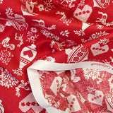 Popeline de coton imprimée pampille de Noël fond rouge
