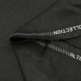 Fantasy wool blend suit fabric in mottled gray with black background