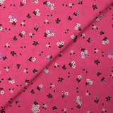 Popeline de coton imprimée fleurs printanières fond rose barbie