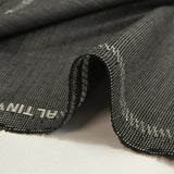 Tissu tailleur laine mélangée fantaisie gris clair fond noir