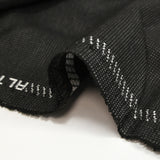 Fantasy wool blend suit fabric in mottled gray with black background