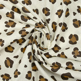 Coton imprimé léopard marron fond blanc cassé