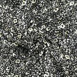 Mousseline imprimée bande satin fleurs fond noir
