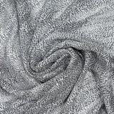 Mousseline imprimée bande satin léopard noir