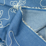Chambray de coton brodé Lucie fond denim