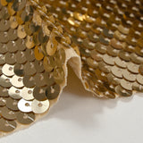 Gold sequins on nude mesh