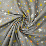 Popeline de coton imprimée étoile orange et jaune fond gris