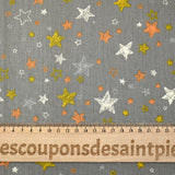 Popeline de coton imprimée étoile orange et jaune fond gris