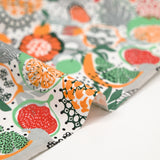 Popeline de coton imprimée fruit exotique orange et vert