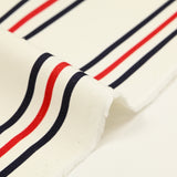 Gabardine 100% coton rayure bleu marine et rouge fond blanc cassé