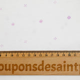 Viscose imprimée signes violet fond blanc