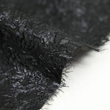 Jacquard soie et polyester rose en tourbillon noir