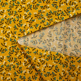 Popeline de coton imprimée pousse fleurie bleu fond jaune soleil