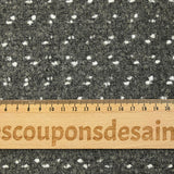 Lainage polyester bouclette et confettis blanc fond gris