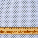 Coton tissé teint imprimé soleil noir fond bleu