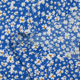 Viscose imprimée fleurs blanches et jaunes fond bleu