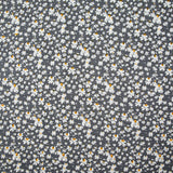 Viscosa estampada flores blancas y amarillas fondo gris antracita