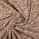 Viscose imprimée fleurs blanches et bordeaux fond noisette
