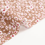Viscose imprimée fleurs blanches et bordeaux fond noisette