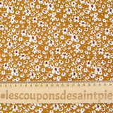 Viscose imprimée fleurs blanches et bordeaux fond ocre