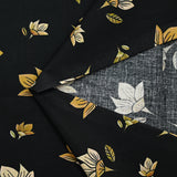Popeline de coton imprimée fleur jaune pastel et miel fond noir