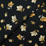 Popeline de coton imprimée fleur jaune pastel et miel fond noir