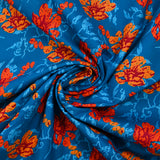 Popeline de coton imprimée fleur stylisée orange fond turquoise
