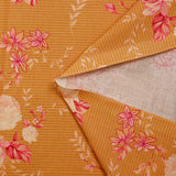 Popeline de coton imprimée rosier rose fond rayé orange