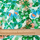 Viscose imprimée jacquard papillons bleus et verts fond blanc