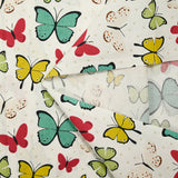 Popeline de coton imprimée papillon pois beige fond blanc