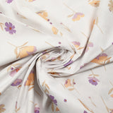Popeline de coton imprimée fleurs pastel mauve et pêche fond blanc