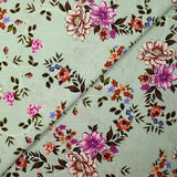 Popeline de coton imprimée fleur arabesque violet fond vert de gris