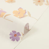 Popeline de coton imprimée fleurs pastel mauve et pêche fond blanc