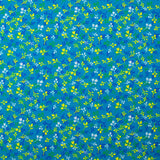 Popeline de coton imprimée bourgeon jaune et bleu fond turquoise
