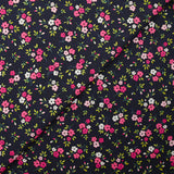 Popeline de coton imprimée mini fleur rose fond bleu minéral