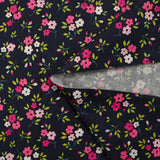 Popeline de coton imprimée mini fleur rose fond bleu minéral