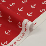 Coton imprimé ancre marine blanche fond rouge