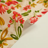 Popeline de coton imprimée fleurs ocre et rouge fond beige