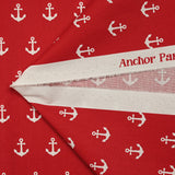 Coton imprimé ancre marine blanche fond rouge