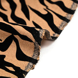 Laine mélangée floquée zèbre velours noir fond camel