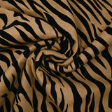 Laine mélangée floquée zèbre velours noir fond camel