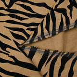 Laine mélangée floquée zèbre velours noir fond camel
